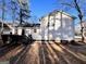 The back deck is ready for entertaining surrounded by trees at 473 Amy Blvd, Temple, GA 30179