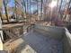 Wooden back deck covered with fall leaves surrounded by trees at 473 Amy Blvd, Temple, GA 30179