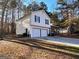 Two-story home with two-car garage, driveway, and partial view of the front porch at 473 Amy Blvd, Temple, GA 30179
