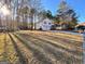 Two-story home featuring a two-car garage, front porch, and scenic foliage at 473 Amy Blvd, Temple, GA 30179
