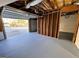 Unfinished garage featuring an open garage door and unfinished walls at 473 Amy Blvd, Temple, GA 30179