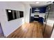 Open kitchen view with stainless steel refrigerator, stainless steel oven, and dark blue cabinets at 473 Amy Blvd, Temple, GA 30179