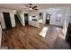 Open-concept living room with hardwood floors and an eat-in kitchen area at 473 Amy Blvd, Temple, GA 30179