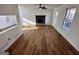 Spacious living room with modern hardwood floors and a rustic fireplace at 473 Amy Blvd, Temple, GA 30179