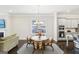 The dining room has a chandelier, a dining table with seating for four, and dark wood floors at 175 Campaign Trl, Fayetteville, GA 30214