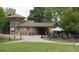 A building featuring a brick facade, covered entryway, and manicured lawn at 175 Campaign Trl, Fayetteville, GA 30214