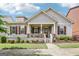 Charming home featuring a welcoming front porch, well-manicured landscaping, and classic architectural details at 175 Campaign Trl, Fayetteville, GA 30214