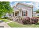 Charming home featuring a welcoming front porch, well-manicured landscaping, and classic architectural details at 175 Campaign Trl, Fayetteville, GA 30214