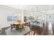 Open-concept kitchen and dining area with a large island, stainless steel appliances, and natural light at 175 Campaign Trl, Fayetteville, GA 30214