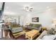 The living room features hardwood floors, neutral colored walls, and comfortable couches and chairs at 175 Campaign Trl, Fayetteville, GA 30214