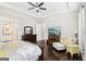 The main bedroom has tray ceilings, a ceiling fan, and a sitting area with a couch and side table at 175 Campaign Trl, Fayetteville, GA 30214