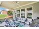 A covered patio featuring cozy seating arrangements, perfect for outdoor entertaining and relaxation at 175 Campaign Trl, Fayetteville, GA 30214
