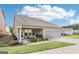 A house with a two-car garage, cozy outdoor seating, and a well-maintained yard at 175 Campaign Trl, Fayetteville, GA 30214
