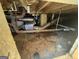 Basement interior featuring ductwork, plumbing and electricals under exposed wooden beams at 1800 Austin Dr, Decatur, GA 30032