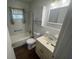 Clean bathroom featuring white tiling, a vanity with storage, and a shower-tub combination at 1800 Austin Dr, Decatur, GA 30032