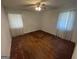Bright bedroom featuring hardwood floors and large windows with sheer curtains at 1800 Austin Dr, Decatur, GA 30032
