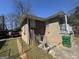 Brick house showcasing backyard with fenced area, gated access, and partial view of a red truck at 1800 Austin Dr, Decatur, GA 30032