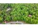 Lush, wooded property featuring a residence tucked away amongst mature trees and manicured lawns at 145 Flat Creek Ct, Fayetteville, GA 30214