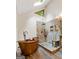 Bathroom featuring a soaking tub and a shower with glass door at 145 Flat Creek Ct, Fayetteville, GA 30214