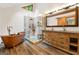 Bathroom featuring a copper soaking tub, and a walk-in shower with glass door at 145 Flat Creek Ct, Fayetteville, GA 30214