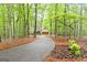 Winding driveway leading to a house, showcasing the property's secluded location at 145 Flat Creek Ct, Fayetteville, GA 30214