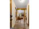 Entryway features hardwood floors leading to a comfortable living room with a stone fireplace at 145 Flat Creek Ct, Fayetteville, GA 30214