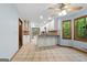 Wide-angle view of kitchen with eat-in area, lots of counterspace, and views to the outdoors at 145 Flat Creek Ct, Fayetteville, GA 30214