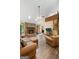 Bright living room boasts hardwood floors, stone fireplace, spiral staircase, and high ceilings at 145 Flat Creek Ct, Fayetteville, GA 30214