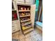 Kitchen pantry includes pull-out wooden shelves for organized food storage at 145 Flat Creek Ct, Fayetteville, GA 30214