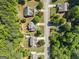 Aerial view of neighborhood with homes and a community swimming pool, surrounded by trees at 3129 Oak Ridge Ln, Loganville, GA 30052