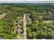The aerial view shows houses surrounded by trees, giving a sense of the neighborhood at 3129 Oak Ridge Ln, Loganville, GA 30052