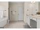 This bathroom features a combination tub and shower, with a vanity and towel rack at 3129 Oak Ridge Ln, Loganville, GA 30052