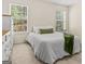Bright bedroom with a large windows, neutral carpet, and ample space for furnishings at 3129 Oak Ridge Ln, Loganville, GA 30052