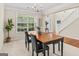 Bright dining room with large window, chandelier, and space for a formal dining set at 3129 Oak Ridge Ln, Loganville, GA 30052