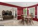 Inviting dining room with wood table set and plenty of natural light, open to the living room at 3129 Oak Ridge Ln, Loganville, GA 30052