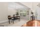 Dining room with large windows, chandelier, view of front entrance, adjacent to foyer at 3129 Oak Ridge Ln, Loganville, GA 30052