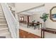 Grand entryway featuring a staircase, hardwood floors, and views into the dining and living areas at 3129 Oak Ridge Ln, Loganville, GA 30052