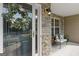 Cozy front porch with stone accent wall, seating, and decorative wreath on the glass front door at 3129 Oak Ridge Ln, Loganville, GA 30052