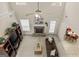 Top-down view of the living room with a stone fireplace, ceiling fan, and open layout at 3129 Oak Ridge Ln, Loganville, GA 30052