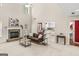 Spacious living room with a stone fireplace, large windows, and an open view to the kitchen at 3129 Oak Ridge Ln, Loganville, GA 30052