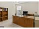 Office featuring large desk, carpeted floor, a bookshelf and a large window at 3129 Oak Ridge Ln, Loganville, GA 30052