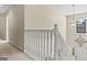 The staircase features white wooden banisters, carpeted steps, and a decorative light fixture at 3129 Oak Ridge Ln, Loganville, GA 30052