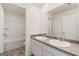 Bathroom with dual sinks, modern fixtures, and a tub-shower combination at 146 Oakchase Park Lane, Hampton, GA 30228