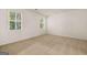 Bedroom with large window, plush carpeting, and neutral walls at 146 Oakchase Park Lane, Hampton, GA 30228