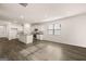 Spacious living room features sleek hardwood floors, modern lighting, and an open layout perfect for entertaining guests at 146 Oakchase Park Lane, Hampton, GA 30228