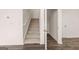 Stairway with carpeted steps and adjacent closet, offering functional design at 146 Oakchase Park Lane, Hampton, GA 30228