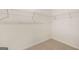 Spacious walk-in closet with wire shelving offers ample storage space for an organized and clutter-free lifestyle at 146 Oakchase Park Lane, Hampton, GA 30228