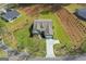 Bird's eye aerial view of a beautiful home featuring a manicured lawn and a spacious driveway at 2124 Gaddis Rd, Canton, GA 30115