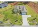 Aerial shot showcasing the property's well-maintained lawn, mature landscaping, and spacious driveway at 2124 Gaddis Rd, Canton, GA 30115