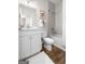 Well-lit bathroom features a tub, shower, and classic white vanity with ample storage at 2124 Gaddis Rd, Canton, GA 30115